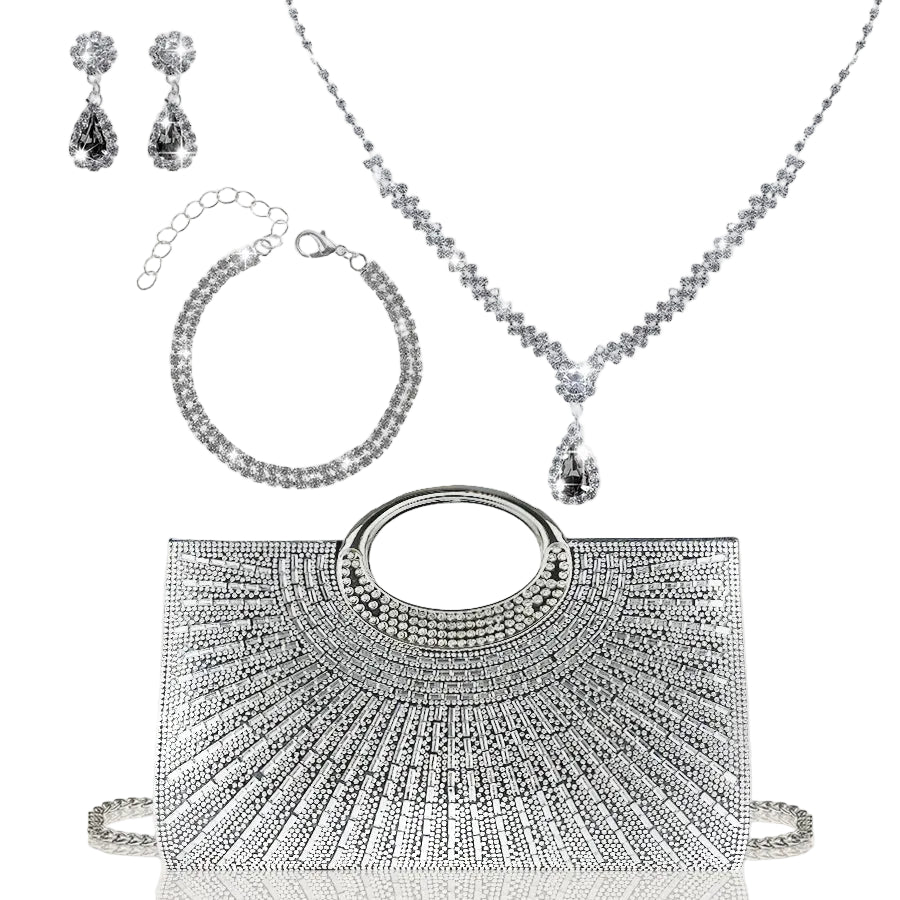 Silver jewelry set including a handbag, necklace, bracelet, and earrings on a light gray background.